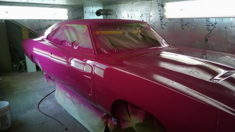 That’s a Panther Pink 70 Charger and it’s getting a white Bee stripe, white vinyl top and black and white tuxedo vinyl interior.